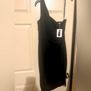 Brand new dress with tickets . Beautiful pin design on both sides. Size M